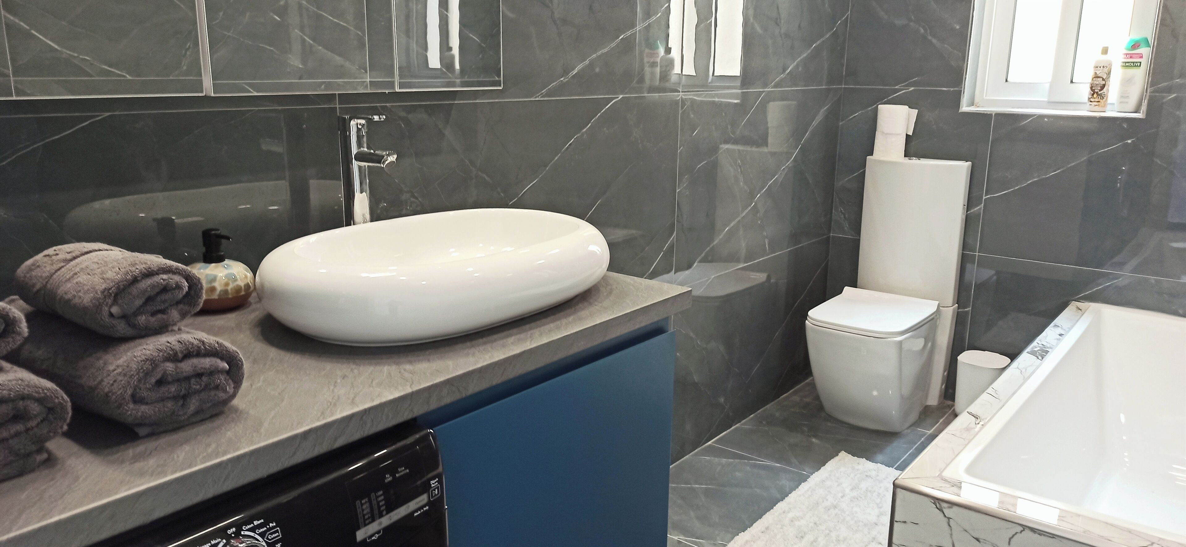 Shower, towels, soap, toilet paper