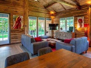 Bungalow | Living room - Spacious Wooden Chalet With Covered Terrace (Baarle-Nassau)