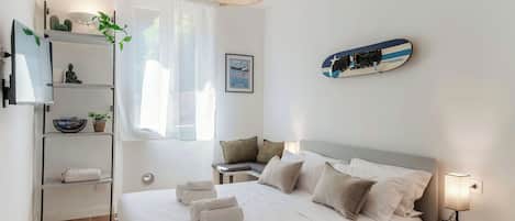 1 bedroom, desk, iron/ironing board, travel crib