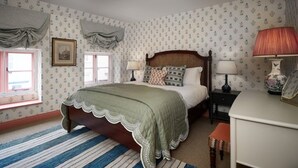 A bedroom with a bed, two bedside tables, a lamp, a framed picture, and a window with curtains. - Townhouse by The Old Bell Hotel -68 Abbey Row (Malmesbury)