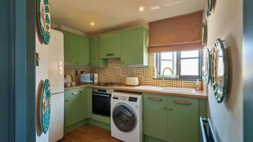 Fridge, microwave, stovetop, cookware/dishes/utensils