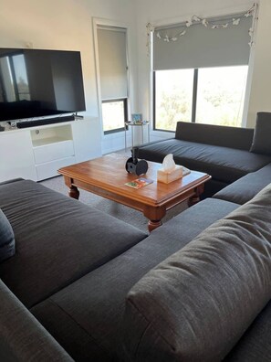 House, 4 Bedrooms, Smoking, Balcony | Living room | Books - Serene Paradise Beach Getaway With Breathtaking Views (Paradise Beach)