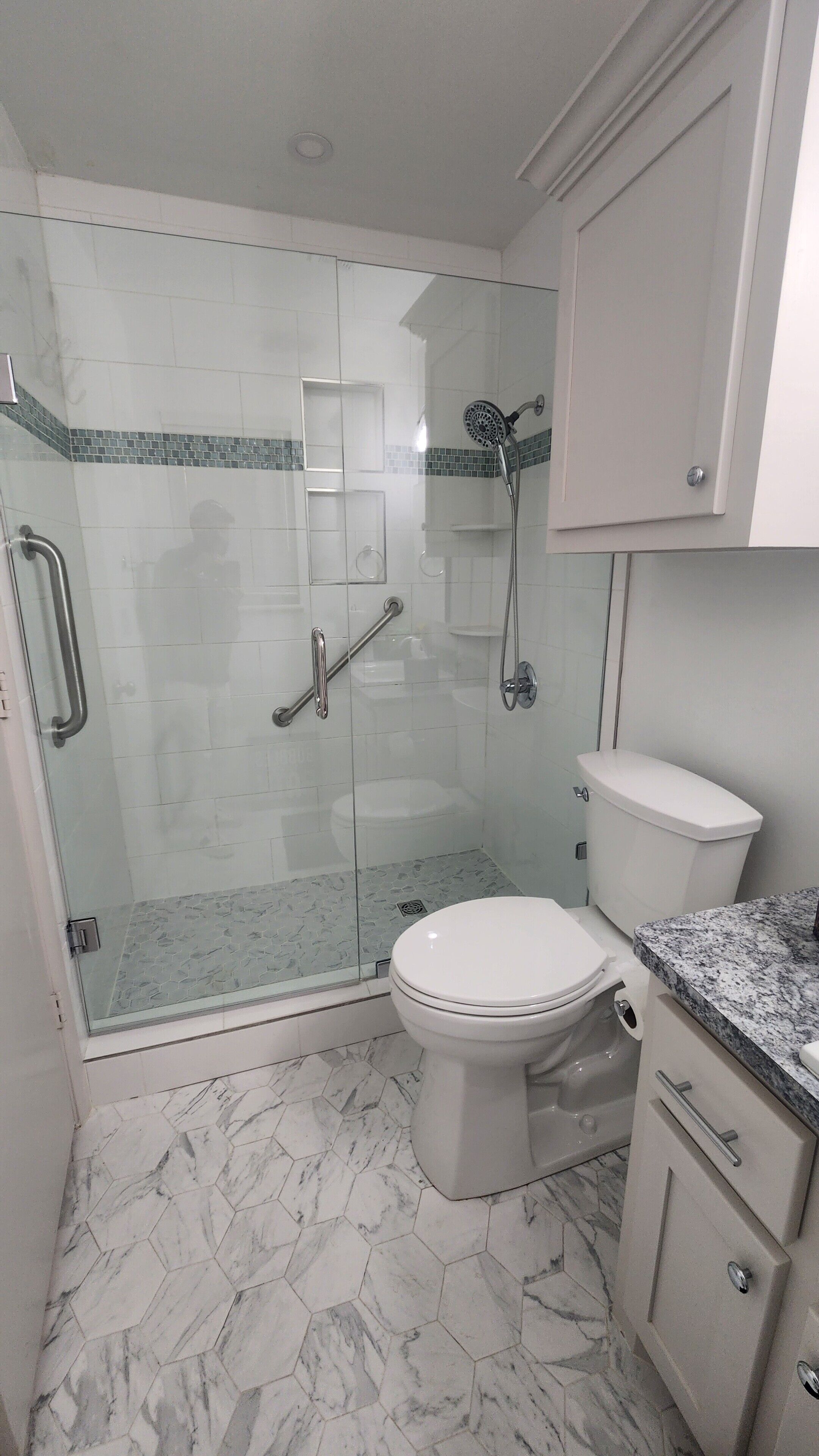 Shower, hair dryer, towels, toilet paper