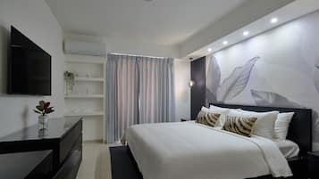 2 dormitorios, tabla de planchar con plancha, ropa de cama