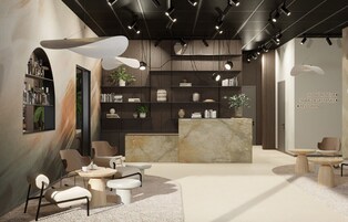 Un interior moderno con un mostrador de recepción, una zona de estar y estanterías con objetos decorativos.