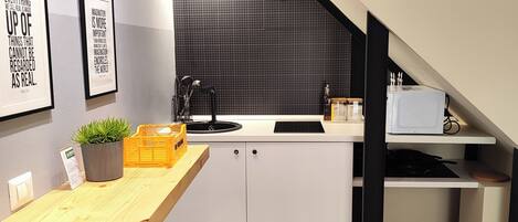 Fridge, microwave, stovetop, coffee/tea maker