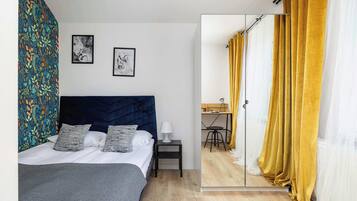 1 bedroom, desk, iron/ironing board, travel crib