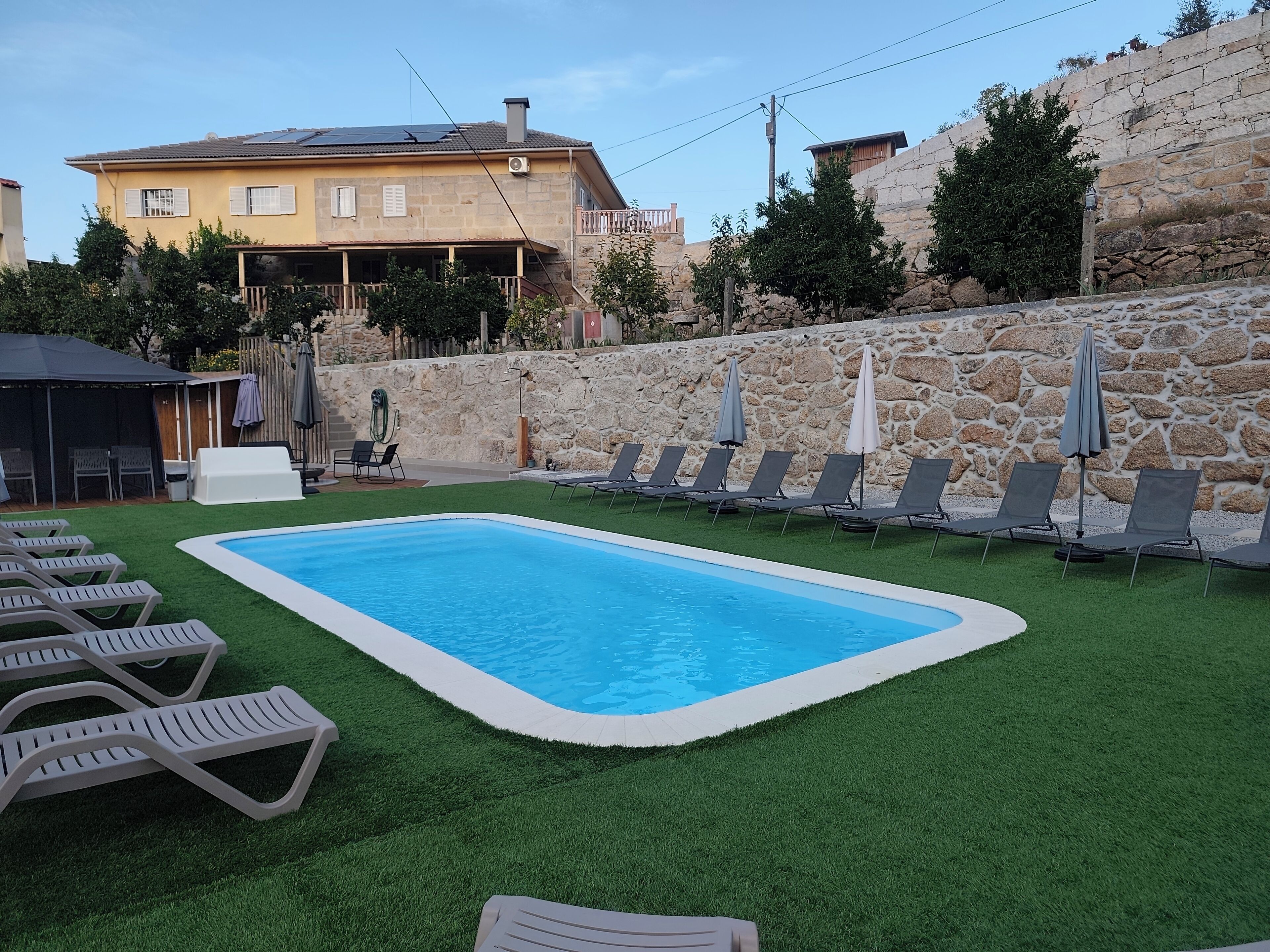 Outdoor pool, pool umbrellas, pool loungers
