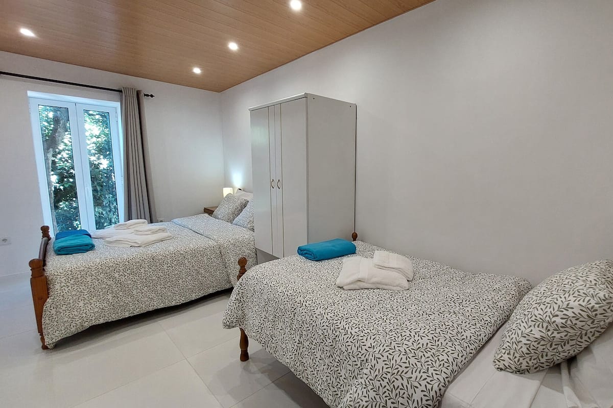 Family Apartment, Garden View | Blackout drapes, iron/ironing board, free WiFi
