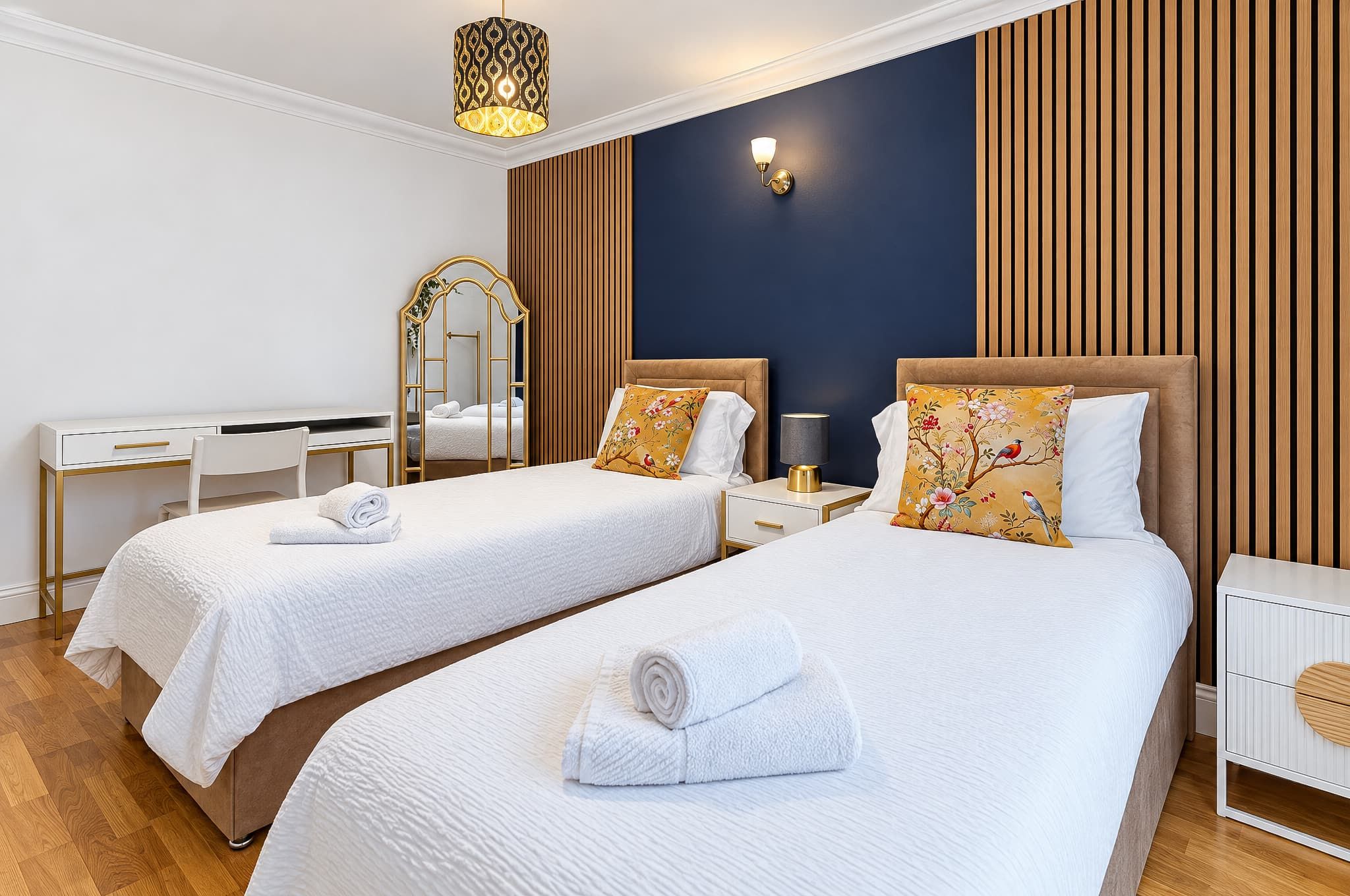 Separate beds and bedside lights give each guest their own place to wind down.