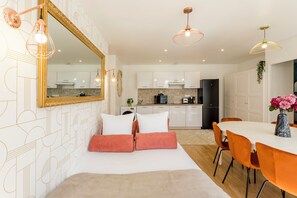 Apartment, Garden View | Living area | 32-inch Smart TV with cable channels, Netflix, streaming services - Merveil Family Suite - Finlay (Paris)