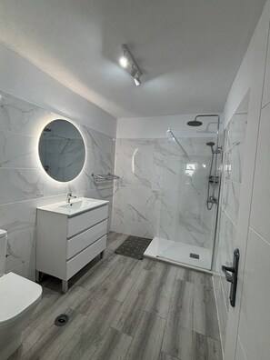 Shower, hair dryer, towels, soap
