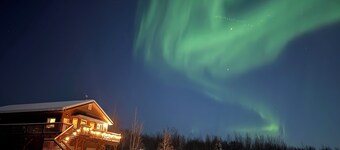 Modern 4-bed home, 10 min from town. Deck with Aurora and mountain views, pond, updated kitchen, master suite with jet tub, radiant floors, fast Wi-Fi. Open concept living and dining. Beautifully renovated inside—cozy, private, and peaceful.