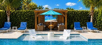 Modern Naples Oasis – Heated Pool, Outdoor TV, Fire Pit & Gazebo Retreat