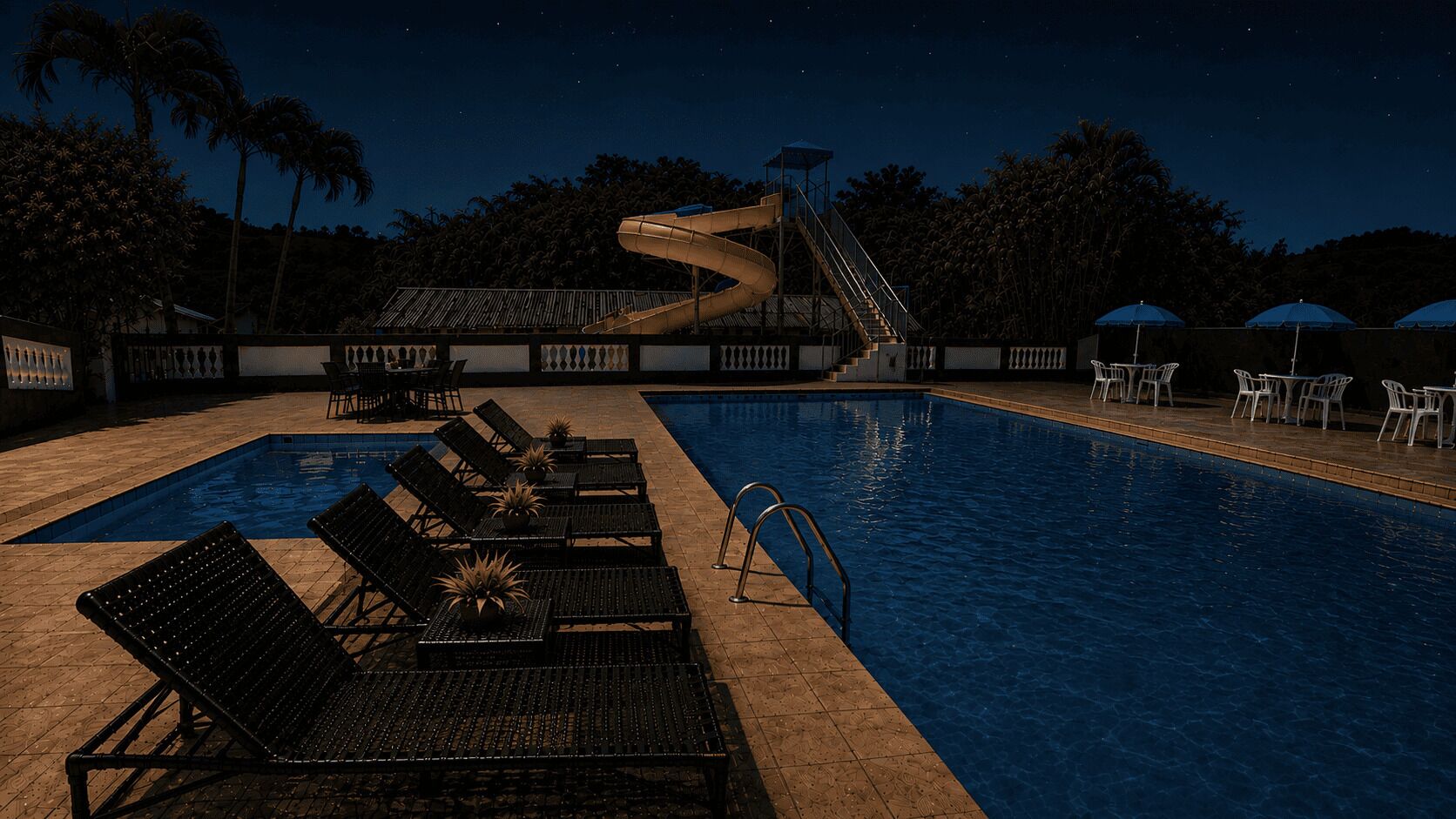 Ein Swimmingpool mit Liegestühlen und einer Rutsche.