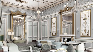 A luxurious room with a grand chandelier, ornate wall decorations, and a fireplace. - Cambridge House, Auberge Collection (London)