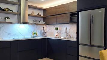 Fridge, microwave, stovetop, coffee/tea maker