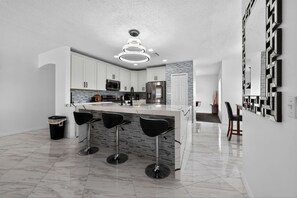 Microwave, oven, stovetop, dishwasher - Elegant 4BR Luxury Home - Private Pool Disney (Kissimmee)