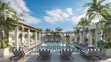 Una piscina al aire libre, camas de piscina gratis