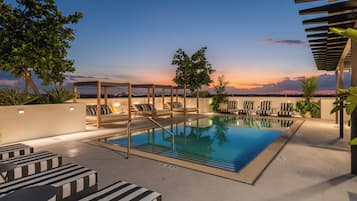 Outdoor pool, open 8:00 AM to 8:00 PM, free cabanas, sun loungers