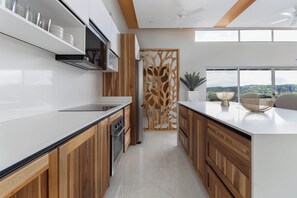 Fridge, microwave, oven, stovetop - Casa Halcón • Modern Luxury Villa • Ocean Views (Coco)