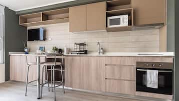 Departamento Confort, vista a la ciudad | Área de sala de estar