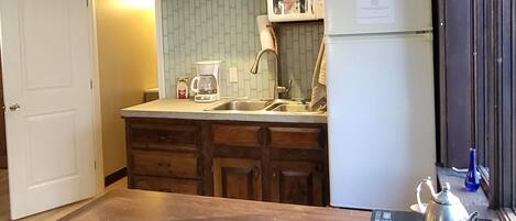 Fridge, microwave, stovetop, coffee/tea maker