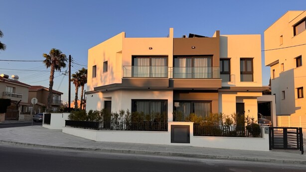 A modern two-story residential building with a flat roof, large windows, and a balcony. - Villa - Sleeps 6 - Near Local Attractions (Limassol)