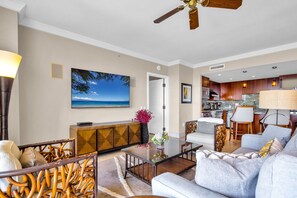 A modern living room with a sofa, coffee table, and dining area. - Honua Kai | Ocean View 8 BR, Sleeps 22 | Car Incl. w/ 6+ Nights | HKK ML-1457 by KBM (Lahaina)