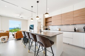 201 - 3 Bedroom Partial Ocean View (2nd Floor) | Private kitchen | Full-size fridge, microwave, oven, stovetop - Point West Premier Rentals (West Bay)
