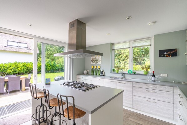 Villa | Private kitchen | Highchair - Spacious and Bright 10-person Holiday Villa (De Koog)