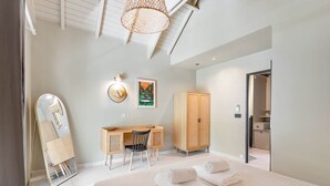 A modern bedroom with a large bed, a desk with a chair, a wardrobe, a mirror, and a ceiling light. - Maison GAMA, 2 bedrooms and shared pool (CISTERN!!!) (Collectivity of Saint Martin)