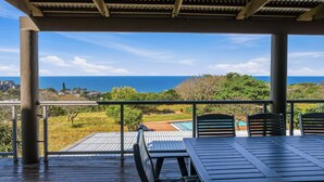 A covered outdoor area with a view of the ocean and a pool. - Simbithi Coastal Escape | Luxury with Ocean Views (Dolphin Coast)