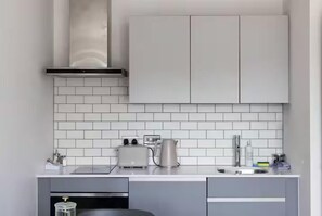 Fridge, oven, toaster, cookware/dishes/utensils