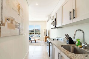 Fridge, microwave, oven, stovetop - Family Suite Marina View 3 Bedroom (Playa Flamingo)