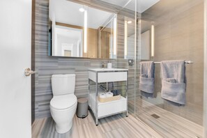 Shower, hair dryer, towels, soap