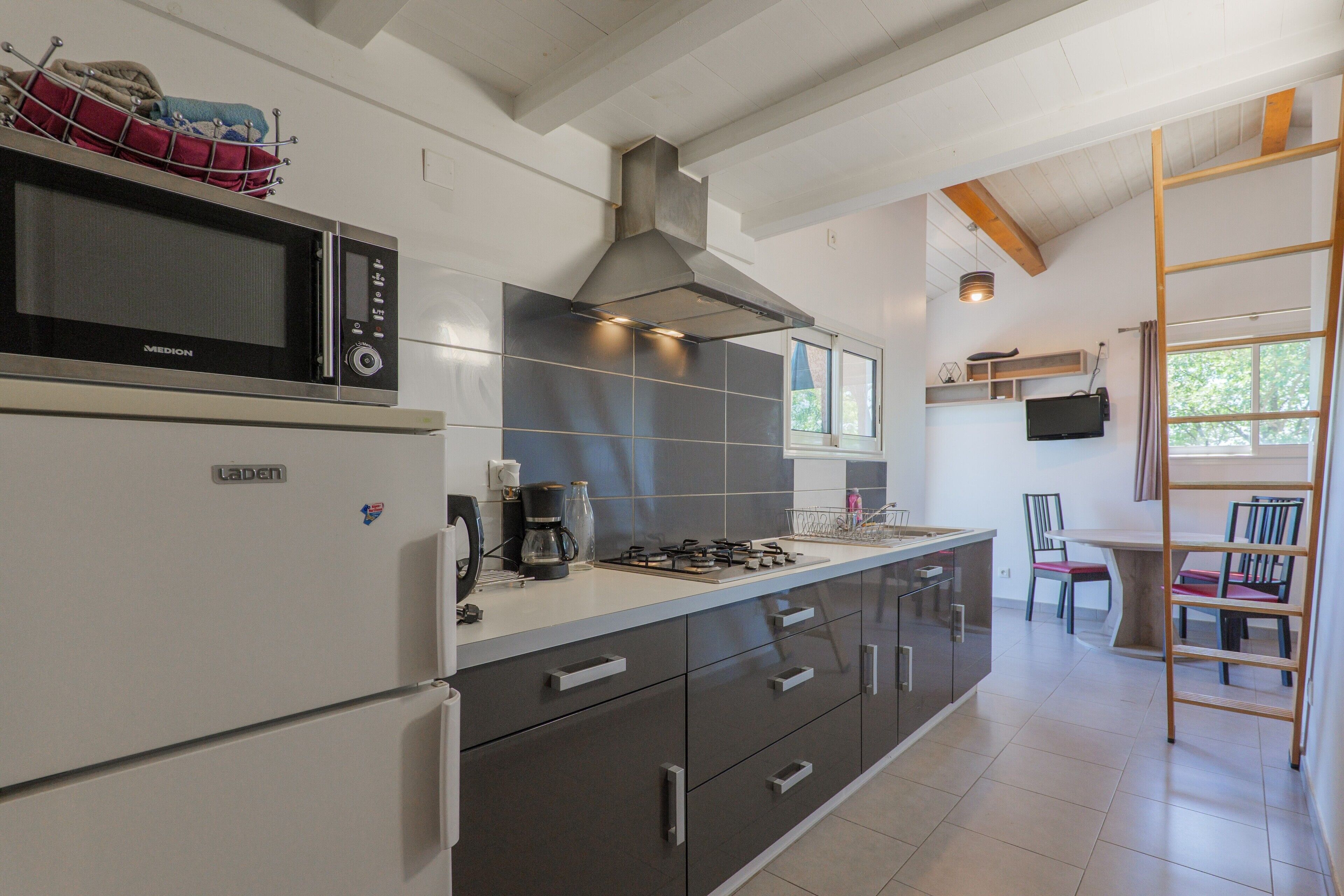 Fridge, microwave, stovetop, coffee/tea maker