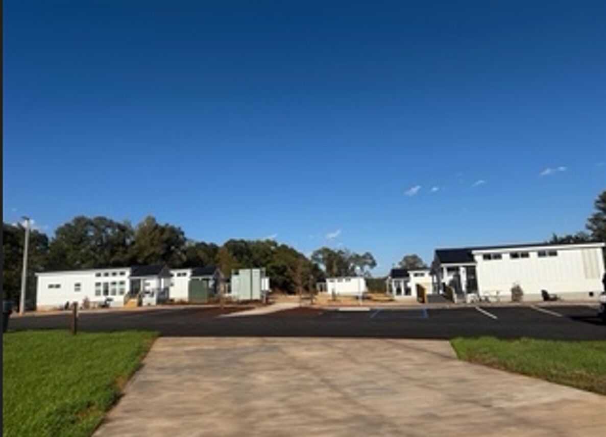 A parking lot with a building in the background.