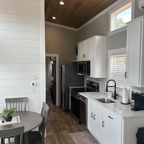 Cabin, 1 King Bed with Sofa bed, Courtyard View | Private kitchen | Microwave, cookware/dishes/utensils