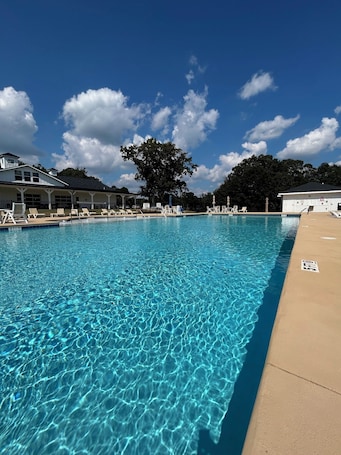 Seasonal outdoor pool, open 7:00 AM to 10:00 PM, pool umbrellas