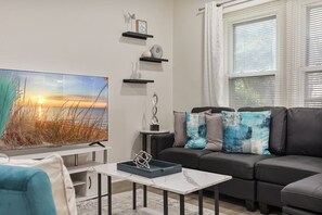 Smart TV, fireplace, books, stereo