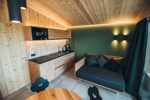 Family Apartment, Mountain View | Living area | 25-inch LED TV with satellite channels, toys, heated floors