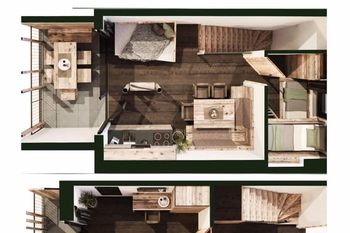 A modern interior with a central living area, a kitchen, and a bedroom.