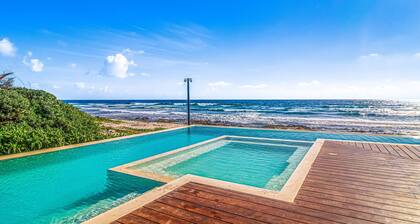 Stylish condo with pool, breezy balcony & full kitchen near cenotes