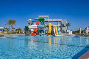 A swimming pool with a water slide structure. - Sataya Resort Marsa Alam (Qesm Marsa Alam)