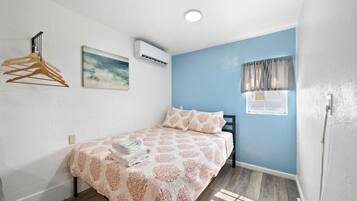 1 bedroom, desk, iron/ironing board, travel crib