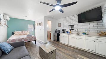 1 bedroom, desk, iron/ironing board, travel crib