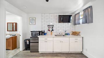 Fridge, microwave, stovetop, coffee/tea maker