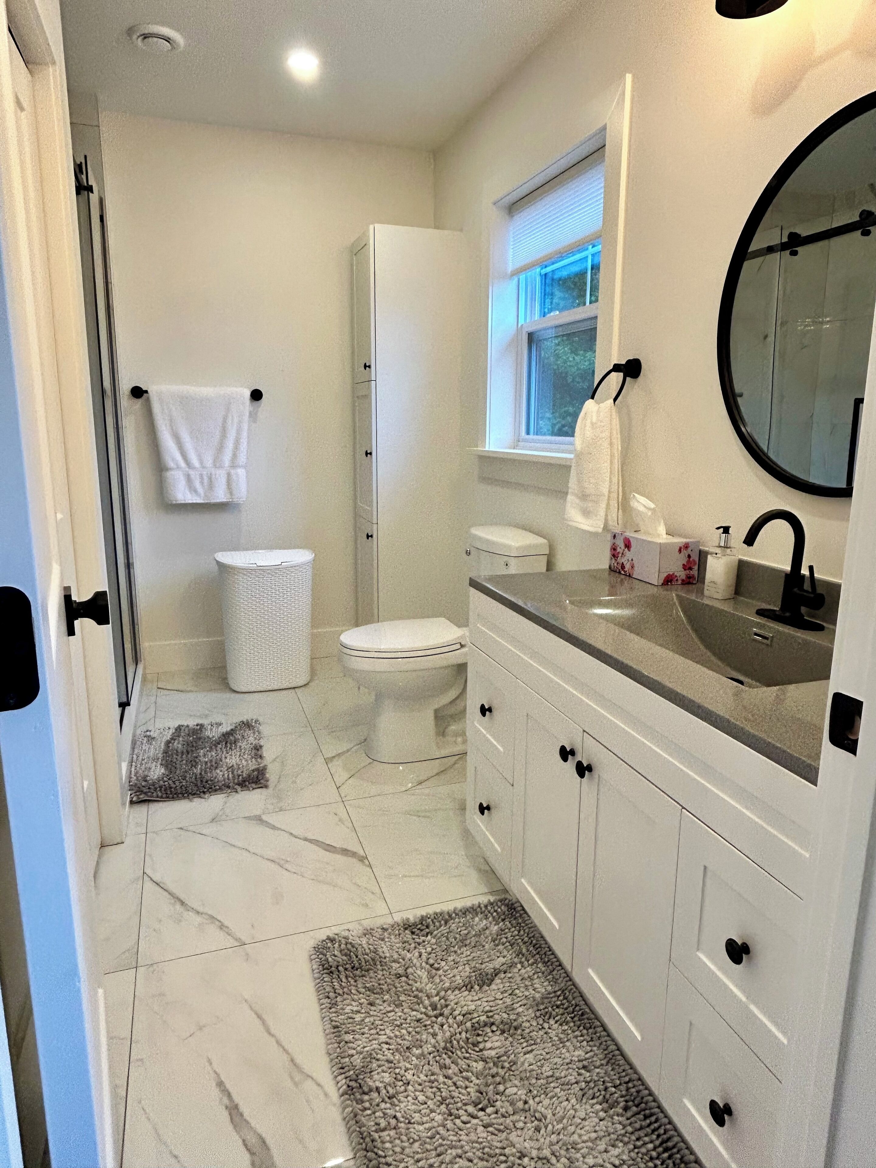 Shower, hair dryer, towels, soap