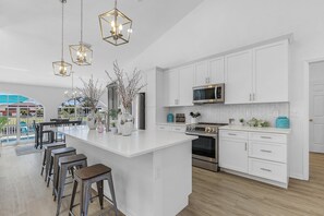 Fridge, microwave, oven, stovetop - Sophisticated 3 BR waterfront Villa with heated pool, hot tub, kayaks, dock and tiki hut (Cape Coral)